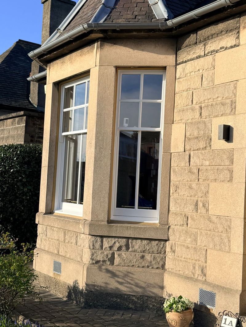 Detail of restored Portobello bay window with slimline double glazing.